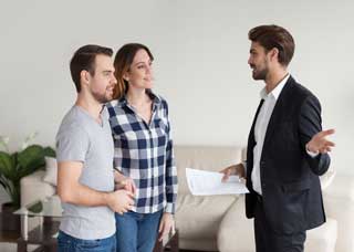 Image of man meeting with a man and woman couple